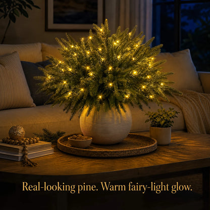 Warm fairy-light glow among realistic-looking pine branches