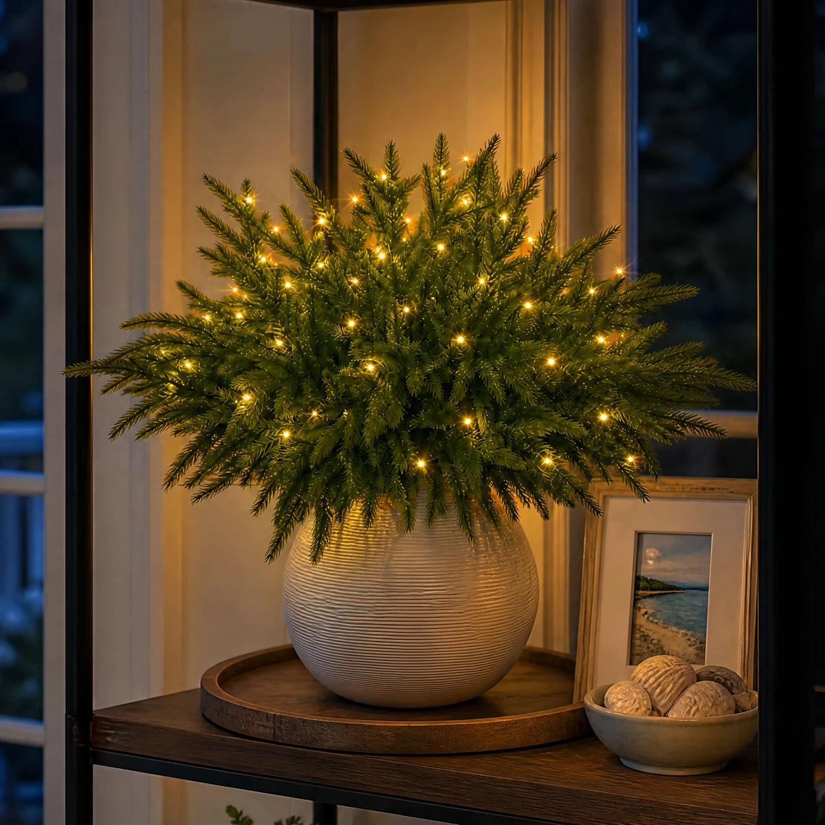 Evergreen pine lights styled on a side table; vase not included