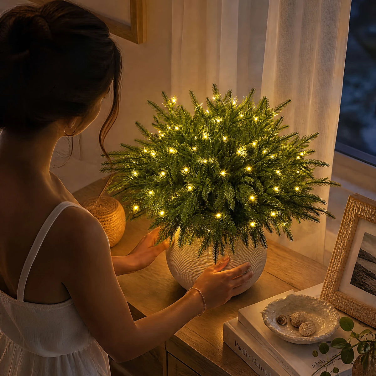 An evergreen pine arrangement styled by hand; vase not included